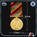 beautiful brass war military medal with ribbon